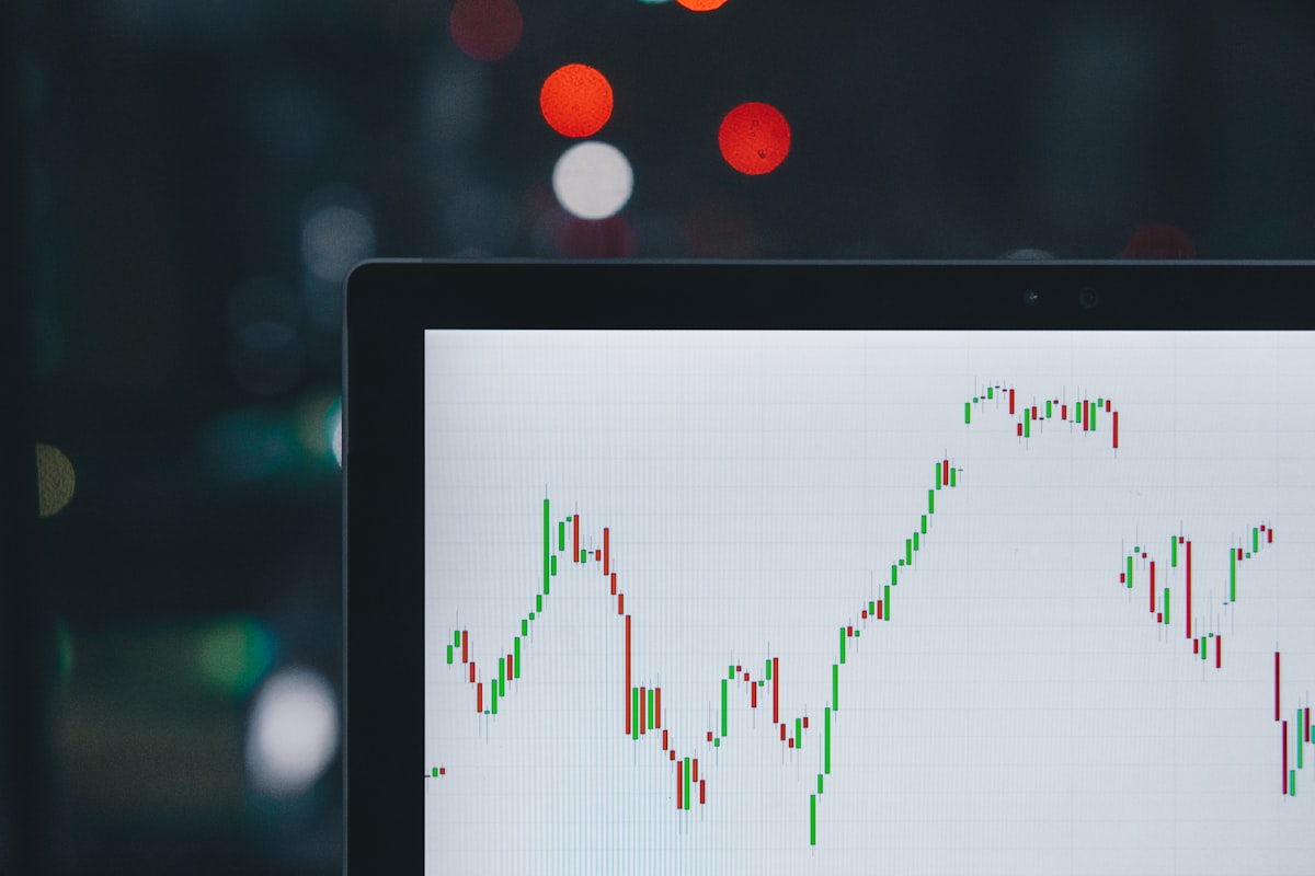 Laptop displaying detailed stock charts from the nightly AI analysis